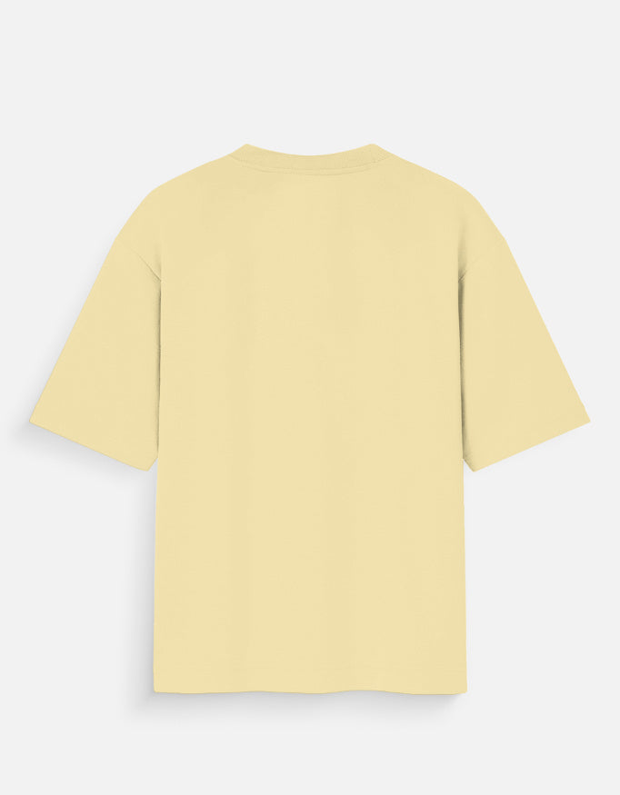 Back view of a plain pale yellow oversized short sleeve cotton t-shirt.