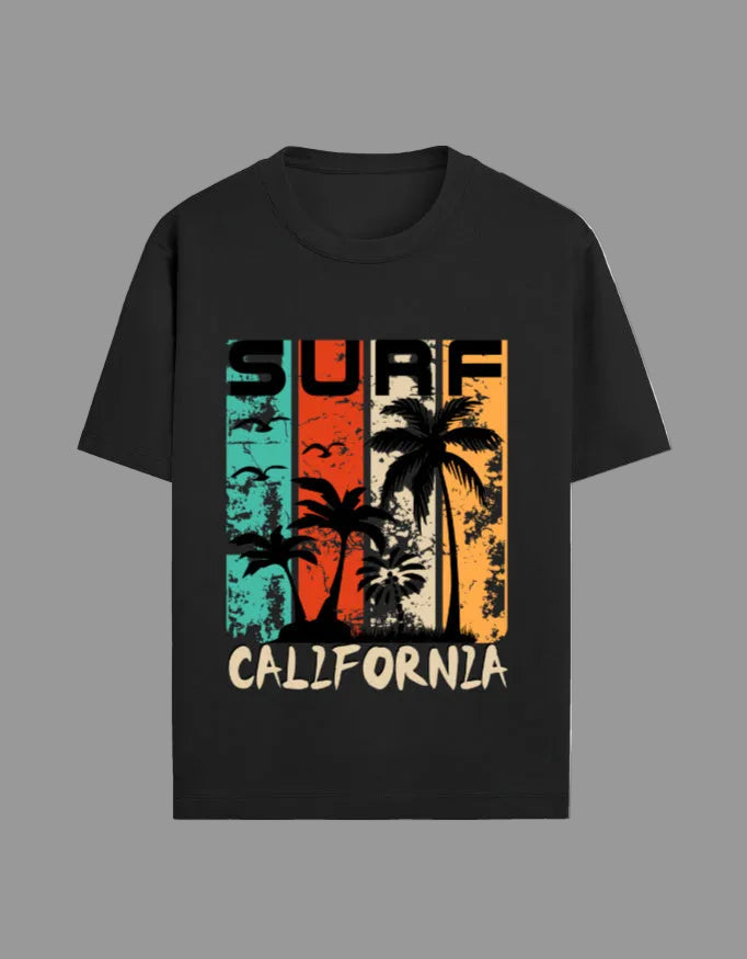Black t-shirt with vintage California surf design featuring palm trees and sunset colors.